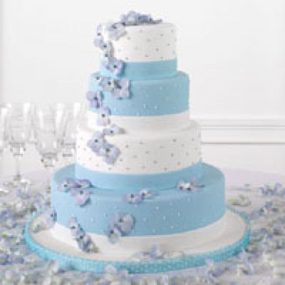 torta nuziale con decorazioni blu